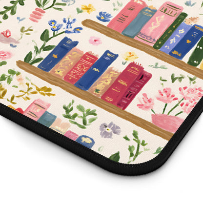 a bookshelf with colorful books and flowers painted on it.