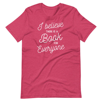 A red t-shirt with white text that reads "I believe there is a book for everyone".