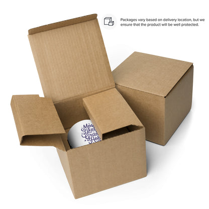 two cardboard boxes, one open and one closed, with a white mug inside the open box.