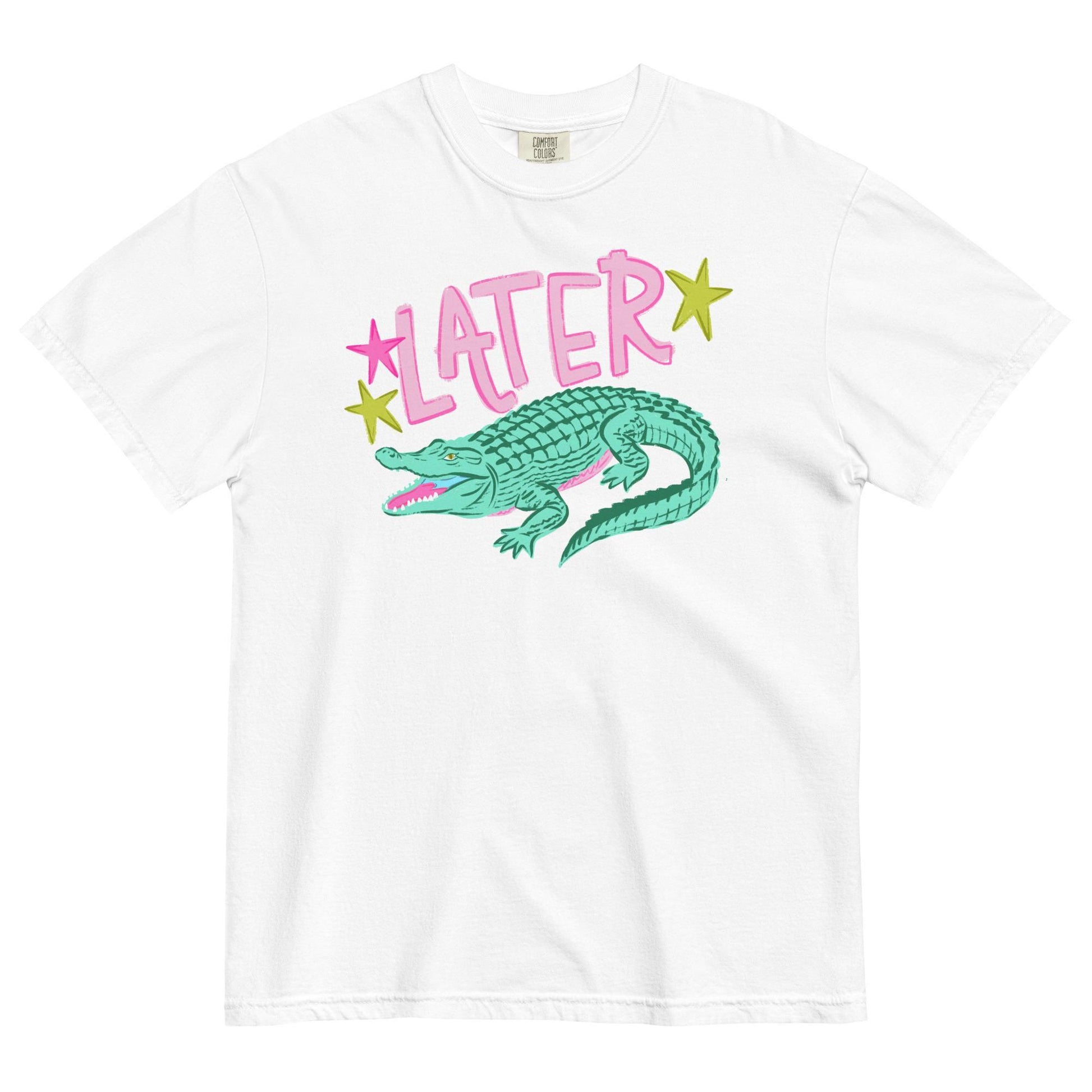 A white t-shirt with a graphic design featuring a green alligator and the word "later" written above it.