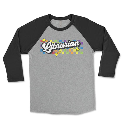 A gray and black long-sleeved shirt with a colorful graphic design on the front, featuring the word "Librarian" and stars.